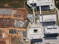 Workers work at the construction site of the second phase of the Foshan -- East and West Guizhou Cooperative Industrial Park in Congjiang Co...