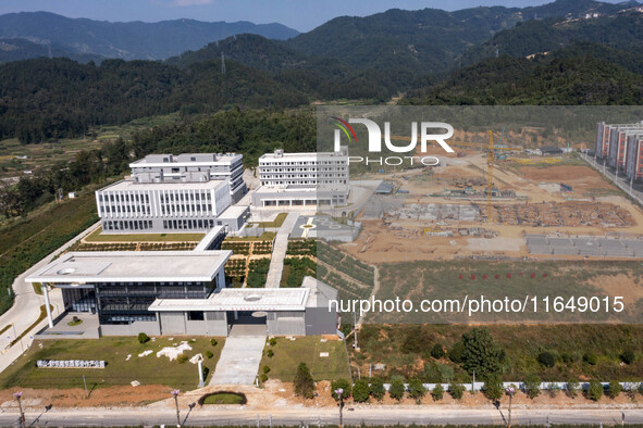 Workers work at the construction site of the second phase of the Foshan -- East and West Guizhou Cooperative Industrial Park in Congjiang Co...