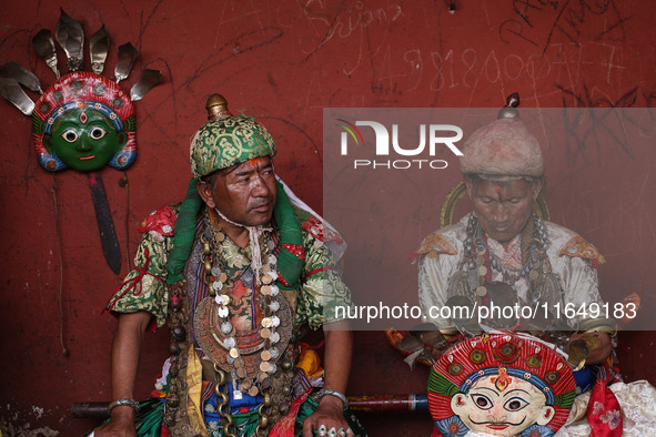 Nepalese devotees impersonate a deity by wearing traditional deity clothes and ornaments for the celebration of the Shikali Festival in Khok...