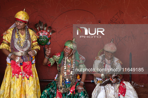 Nepalese devotees impersonate a deity by wearing traditional deity clothes and ornaments for the celebration of the Shikali Festival in Khok...