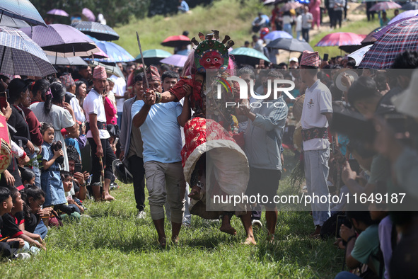 Nepalese devotees impersonate a deity and jump to the tunes of traditional instruments during the celebration of the Shikali Festival in Kho...