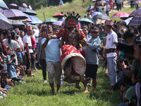 Nepalese devotees impersonate a deity and jump to the tunes of traditional instruments during the celebration of the Shikali Festival in Kho...