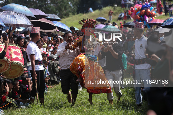 Nepalese devotees impersonate a deity and jump to the tunes of traditional instruments during the celebration of the Shikali Festival in Kho...