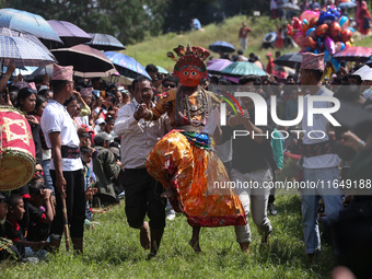 Nepalese devotees impersonate a deity and jump to the tunes of traditional instruments during the celebration of the Shikali Festival in Kho...