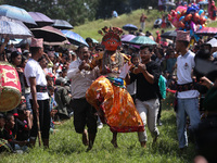 Nepalese devotees impersonate a deity and jump to the tunes of traditional instruments during the celebration of the Shikali Festival in Kho...