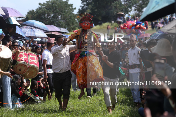 Nepalese devotees impersonate a deity and jump to the tunes of traditional instruments during the celebration of the Shikali Festival in Kho...