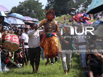 Nepalese devotees impersonate a deity and jump to the tunes of traditional instruments during the celebration of the Shikali Festival in Kho...