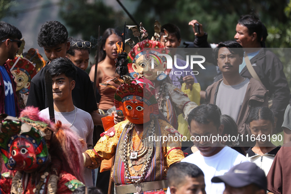 Nepalese devotees impersonate a deity during the celebration of the Shikali Festival in Khokana, Lalitpur, Nepal, on October 8, 2024. 