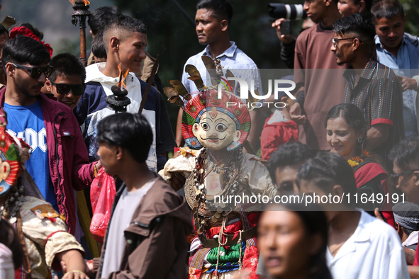 Nepalese devotees impersonate a deity during the celebration of the Shikali Festival in Khokana, Lalitpur, Nepal, on October 8, 2024. 