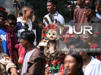 Nepalese devotees impersonate a deity during the celebration of the Shikali Festival in Khokana, Lalitpur, Nepal, on October 8, 2024. (