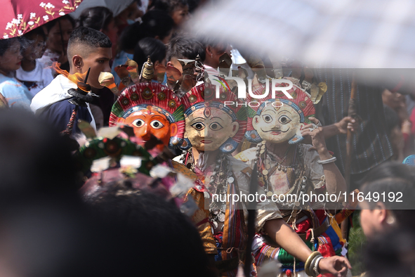 Nepalese devotees impersonate a deity during the celebration of the Shikali Festival in Khokana, Lalitpur, Nepal, on October 8, 2024. 