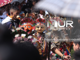 Nepalese devotees impersonate a deity during the celebration of the Shikali Festival in Khokana, Lalitpur, Nepal, on October 8, 2024. (