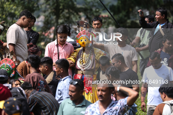 Nepalese devotees impersonate a deity during the celebration of the Shikali Festival in Khokana, Lalitpur, Nepal, on October 8, 2024. 