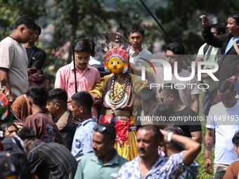 Nepalese devotees impersonate a deity during the celebration of the Shikali Festival in Khokana, Lalitpur, Nepal, on October 8, 2024. (