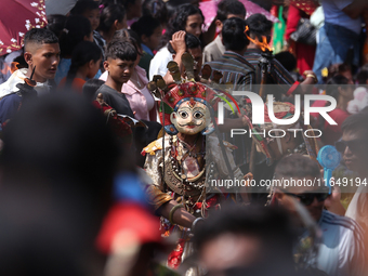 Nepalese devotees impersonate a deity during the celebration of the Shikali Festival in Khokana, Lalitpur, Nepal, on October 8, 2024. (