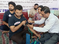 Senior doctors check the health conditions of the trainee and junior doctors who are on a hunger strike in protest against the RG Kar Medica...