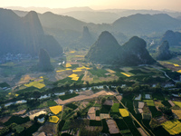 A photo taken in Guilin, China, on October 7, 2024, shows the colorful rice landscape in autumn in South China's Guangxi Zhuang Autonomous r...