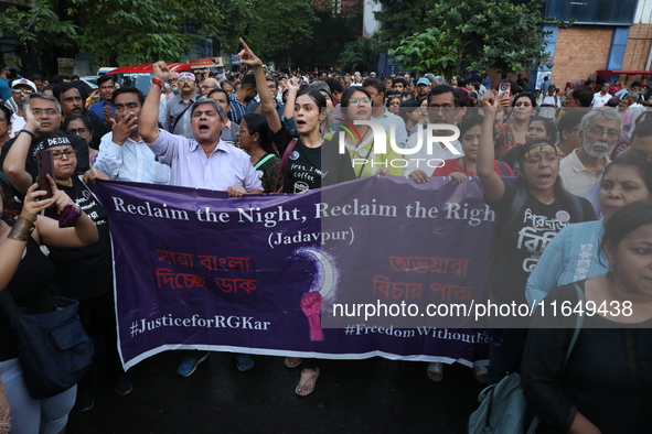 Doctors and citizens shout slogans during a protest march while junior doctors hold a hunger strike to protest against the rape and murder o...