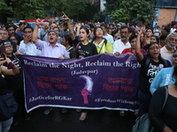 Doctors and citizens shout slogans during a protest march while junior doctors hold a hunger strike to protest against the rape and murder o...