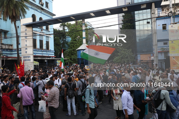 Doctors and citizens shout slogans during a protest march while junior doctors hold a hunger strike to protest against the rape and murder o...