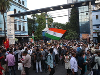 Doctors and citizens shout slogans during a protest march while junior doctors hold a hunger strike to protest against the rape and murder o...