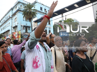 Doctors and citizens shout slogans during a protest march while junior doctors hold a hunger strike to protest against the rape and murder o...