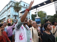 Doctors and citizens shout slogans during a protest march while junior doctors hold a hunger strike to protest against the rape and murder o...