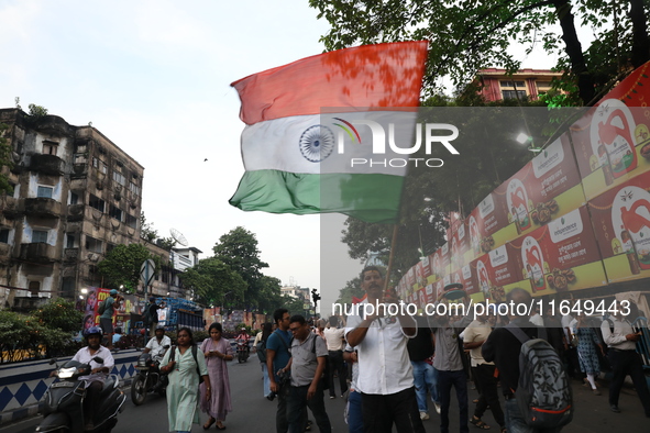 Doctors and citizens shout slogans during a protest march while junior doctors hold a hunger strike to protest against the rape and murder o...