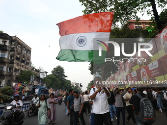 Doctors and citizens shout slogans during a protest march while junior doctors hold a hunger strike to protest against the rape and murder o...