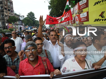 Doctors and citizens shout slogans during a protest march while junior doctors hold a hunger strike to protest against the rape and murder o...