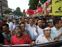 Doctors and citizens shout slogans during a protest march while junior doctors hold a hunger strike to protest against the rape and murder o...