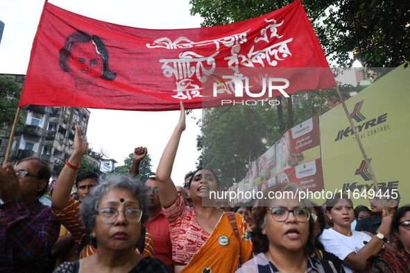 Doctors and citizens shout slogans during a protest march while junior doctors hold a hunger strike to protest against the rape and murder o...