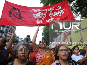 Doctors and citizens shout slogans during a protest march while junior doctors hold a hunger strike to protest against the rape and murder o...