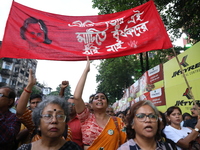 Doctors and citizens shout slogans during a protest march while junior doctors hold a hunger strike to protest against the rape and murder o...