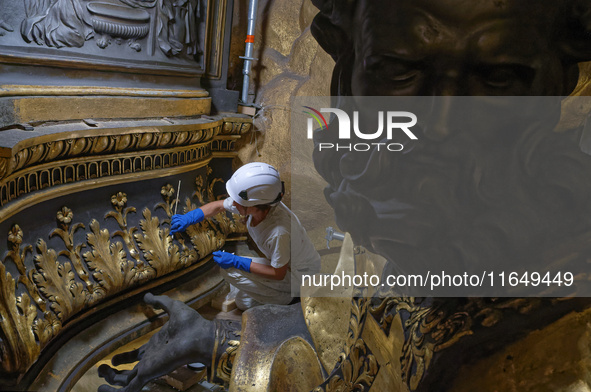 A view during the restoration works of the Chair of Saint Peter, created by Gian Lorenzo Bernini, located in the apse of St. Peter's Basilic...