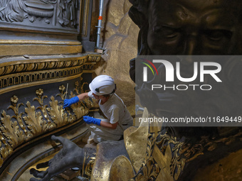 A view during the restoration works of the Chair of Saint Peter, created by Gian Lorenzo Bernini, located in the apse of St. Peter's Basilic...