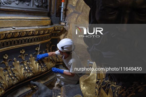 A view during the restoration works of the Chair of Saint Peter, created by Gian Lorenzo Bernini, located in the apse of St. Peter's Basilic...