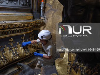 A view during the restoration works of the Chair of Saint Peter, created by Gian Lorenzo Bernini, located in the apse of St. Peter's Basilic...