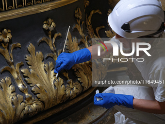 A view during the restoration works of the Chair of Saint Peter, created by Gian Lorenzo Bernini, located in the apse of St. Peter's Basilic...