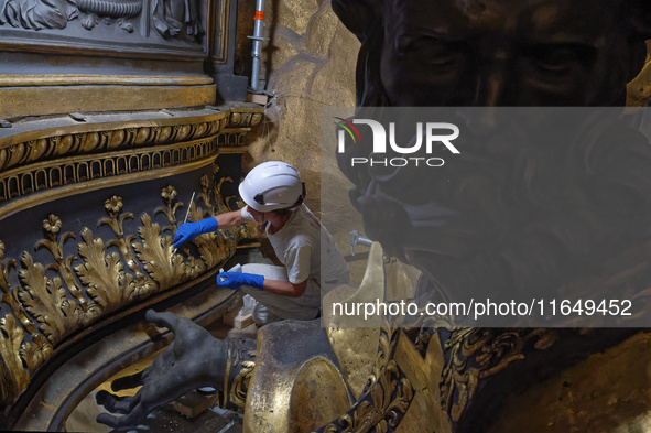 A view during the restoration works of the Chair of Saint Peter, created by Gian Lorenzo Bernini, located in the apse of St. Peter's Basilic...