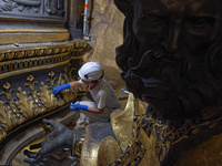 A view during the restoration works of the Chair of Saint Peter, created by Gian Lorenzo Bernini, located in the apse of St. Peter's Basilic...