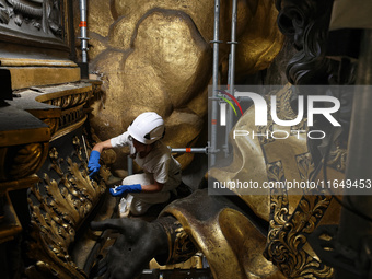 A view during the restoration works of the Chair of Saint Peter, created by Gian Lorenzo Bernini, located in the apse of St. Peter's Basilic...