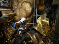 A view during the restoration works of the Chair of Saint Peter, created by Gian Lorenzo Bernini, located in the apse of St. Peter's Basilic...