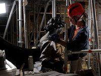 A view during the restoration works of the Chair of Saint Peter, created by Gian Lorenzo Bernini, located in the apse of St. Peter's Basilic...