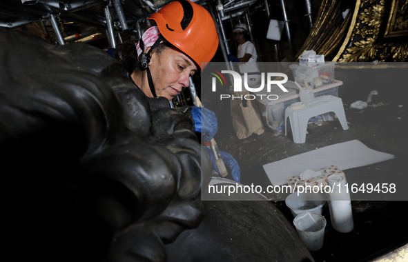 A view during the restoration works of the Chair of Saint Peter, created by Gian Lorenzo Bernini, located in the apse of St. Peter's Basilic...