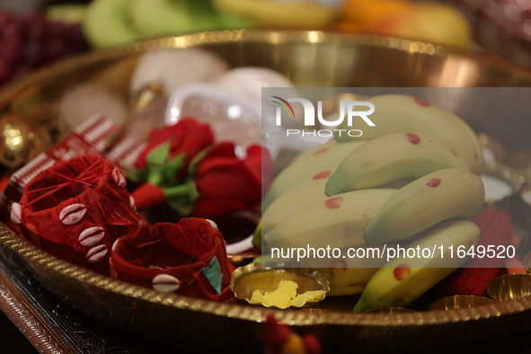 Offerings and other holy items are at a shrine during the Durga Puja festival at a pandal (temporary temple) in Mississauga, Ontario, Canada...