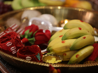 Offerings and other holy items are at a shrine during the Durga Puja festival at a pandal (temporary temple) in Mississauga, Ontario, Canada...