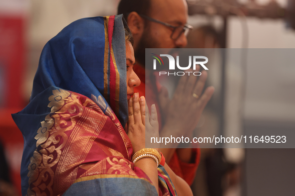 Bengali Hindus offer prayers during the Durga Puja festival at a pandal (temporary temple) in Mississauga, Ontario, Canada, on October 6, 20...