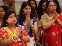 Bengali Hindu women offer prayers during the Durga Puja festival at a pandal (temporary temple) in Mississauga, Ontario, Canada, on October...