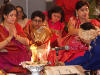 Bengali Hindu women perform prayers during the Durga Puja festival at a pandal (temporary temple) in Mississauga, Ontario, Canada, on Octobe...